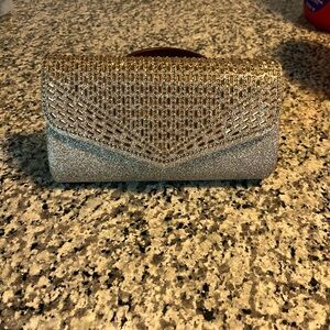 Gold clutch purse. Never used. 9.5 x 5 x 2.5.